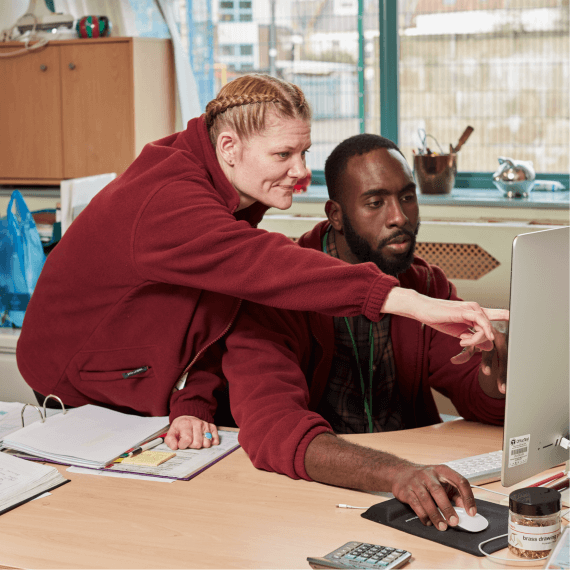 man and woman on computer