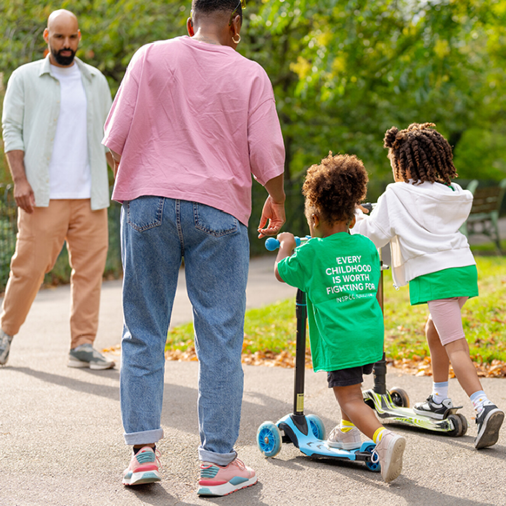 children riding scooters