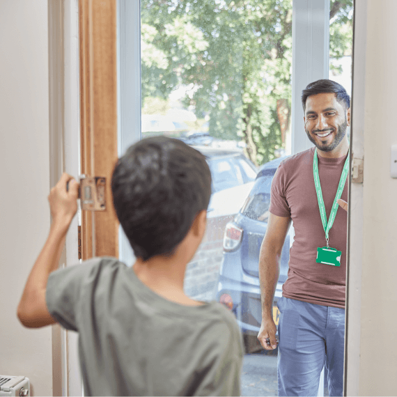 child answering door to NSPCC